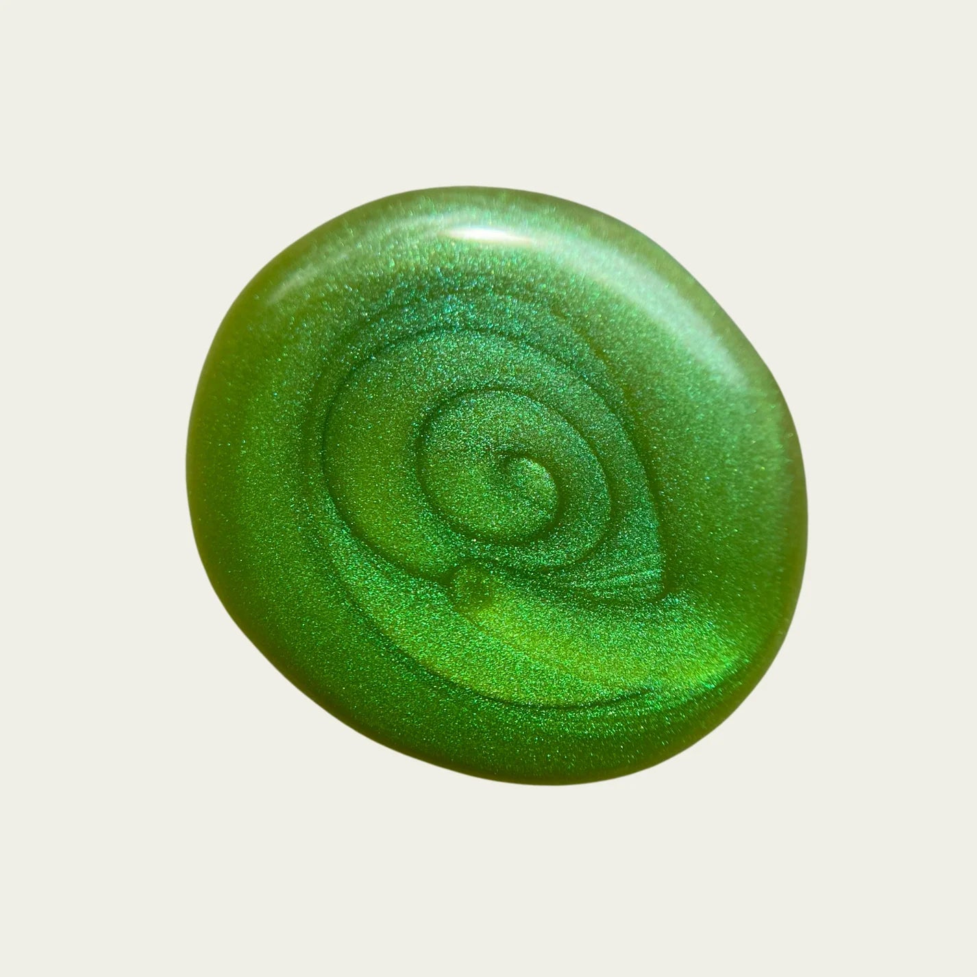 Metallic green polish swatch on white background