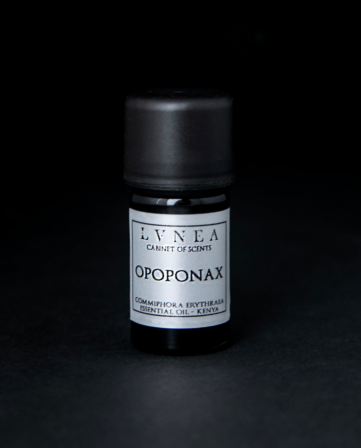 5ml black glass bottle of LVNEA's opoponax essential oil on black background. The bottle has a silver label.