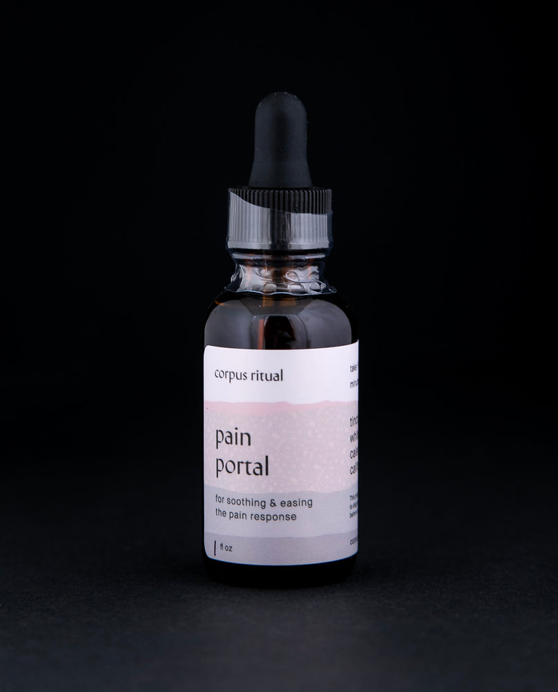 1oz glass amber bottle with black dropper top contains Corpus Ritual's "Pain Portal" tincture on black background