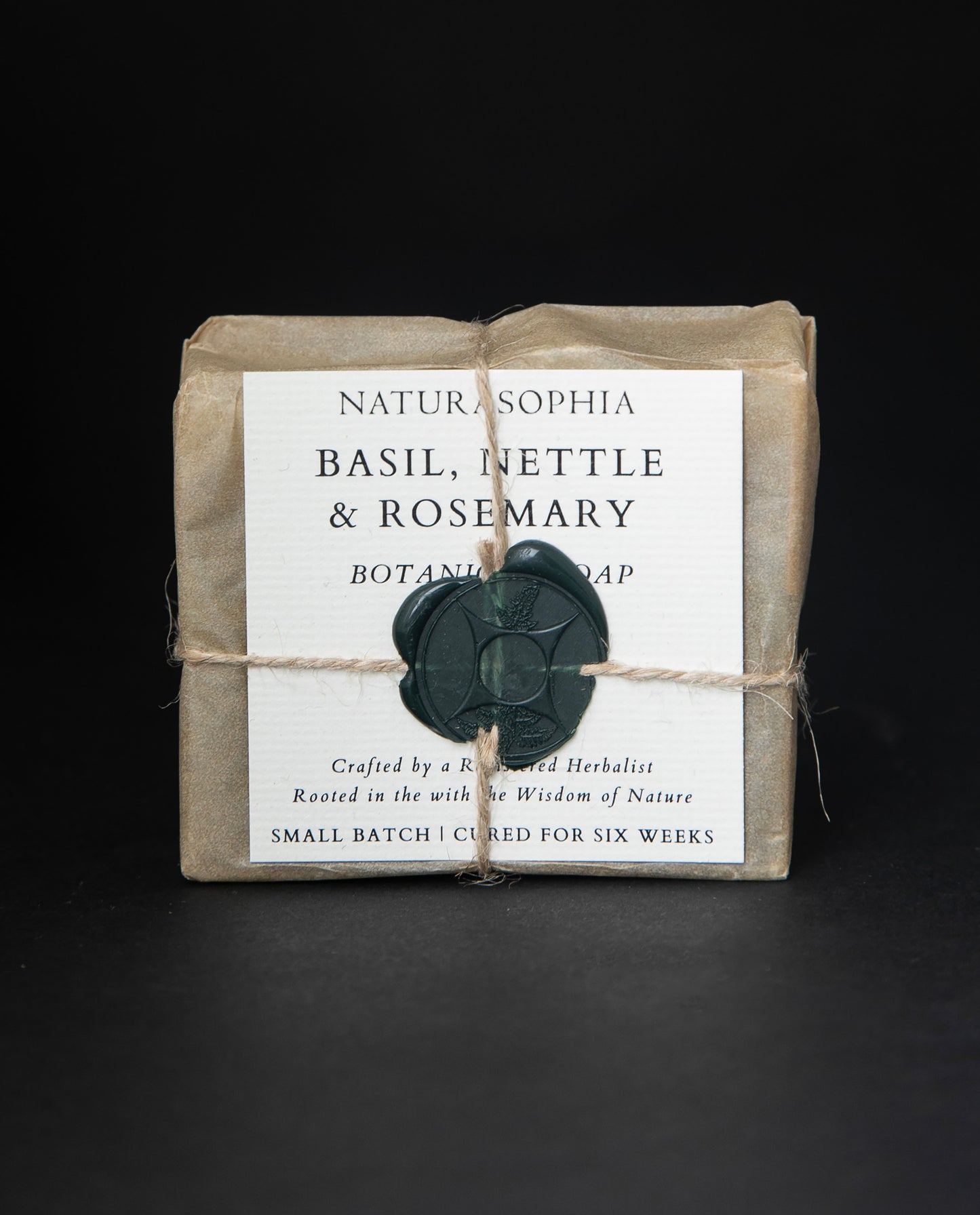 Bar of Naturasophia soap wrapped in brown paper and twine, with a label that reads