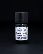 5ml black glass bottle of LVNEA's tomato leaf compound on black background. There is a silver label on the bottle.