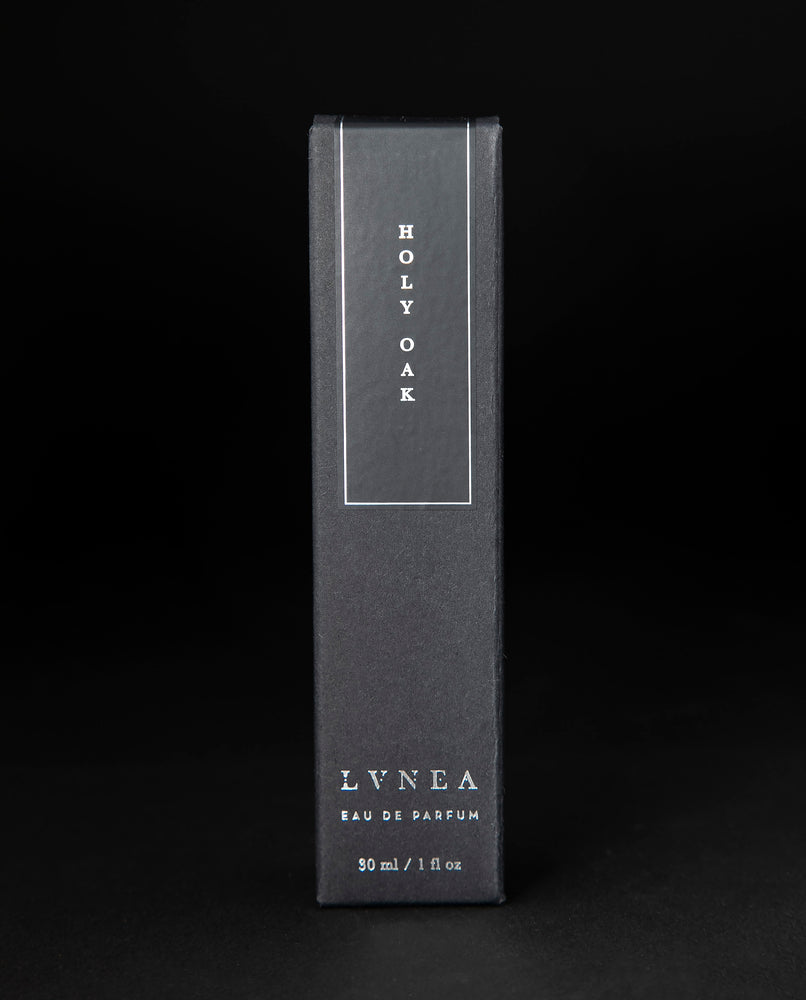 Black box that LVNEA's Holy Oak natural perfume is packaged in on black background