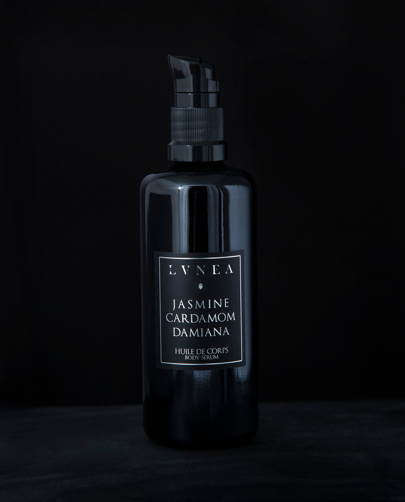 100ml black glass bottle with pump dispenser of LVNEA’s Jasmine, Cardamom and Damiana body serum