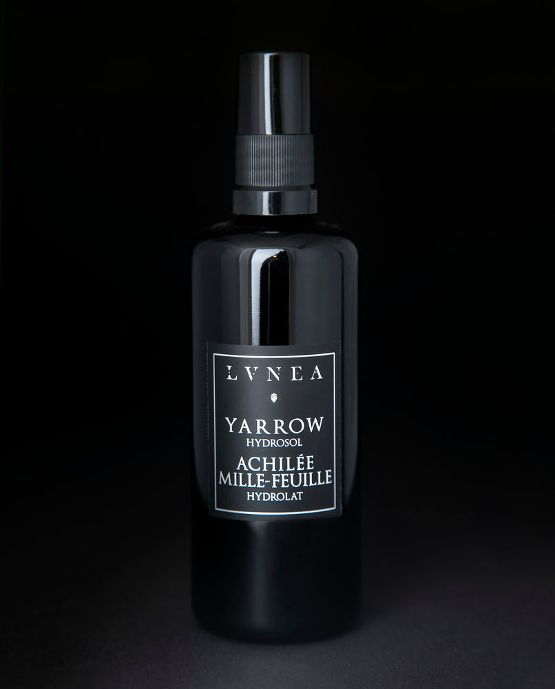 100ml black glass bottle of LVNEA's Yarrow Hydrosol on black background