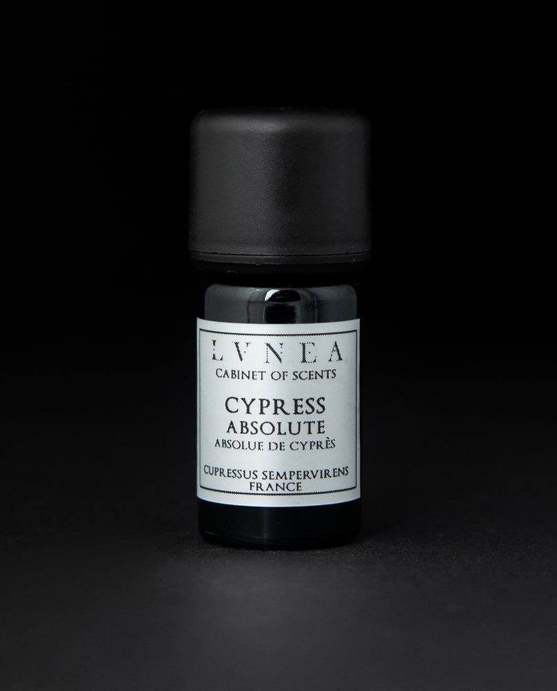 5ml black glass bottle with silver label of LVNEA's cypress absolute on black background