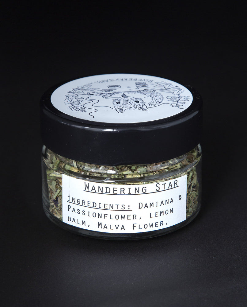 Clear glass jar of blueberryjams' "Wandering Star" rolling blend.