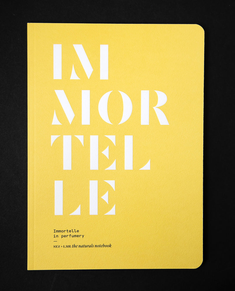 The book "Immortelle in Perfumery" on black background. The cover is canary yellow and reads "IMMORTELLE" in bold white graphic lettering.