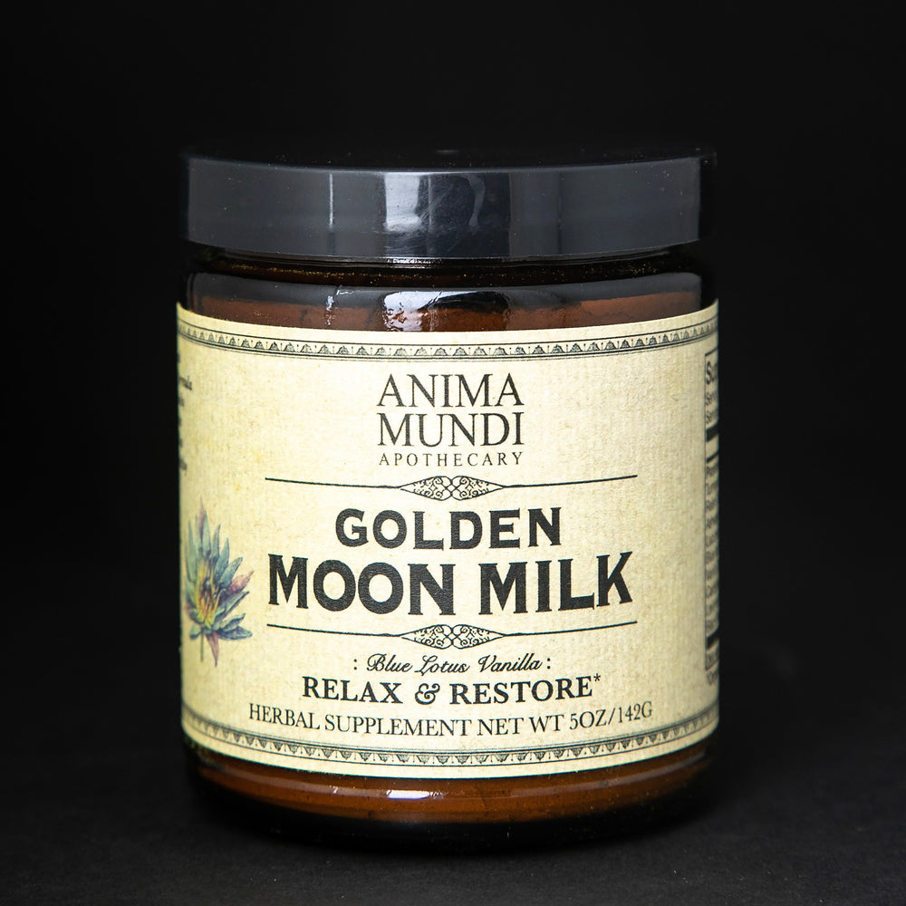 Amber glass jar with black lid and tan label. The jar contains Anima Mundi's "Golden Moon Milk" herbal supplement.