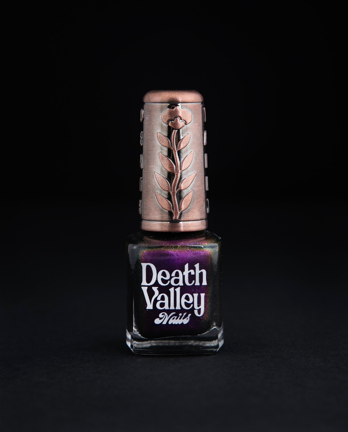 "Bat out of Hell" nail polish on black background. The polish is a multichrome purple colour.
