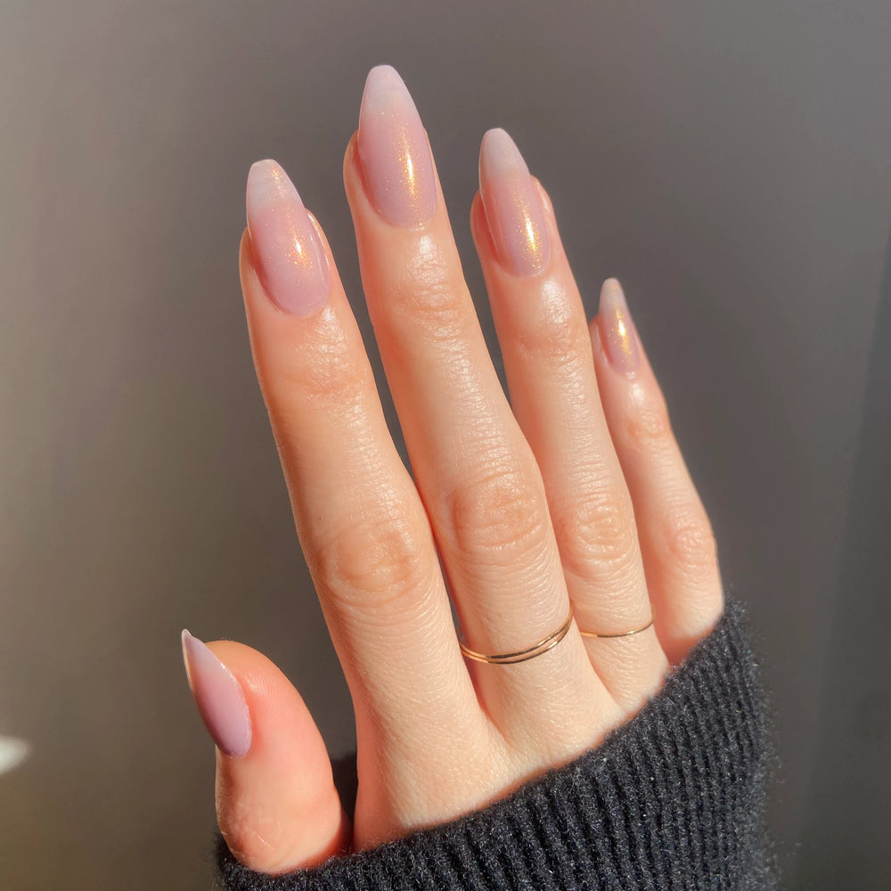 
                      
                        "Aliens" nailpolish shown on a model. It is semi transparent.
                      
                    