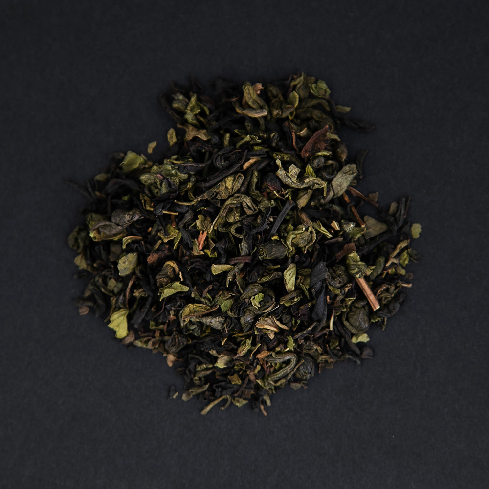 small pile of "casablanca" tea viewed from above against a black background