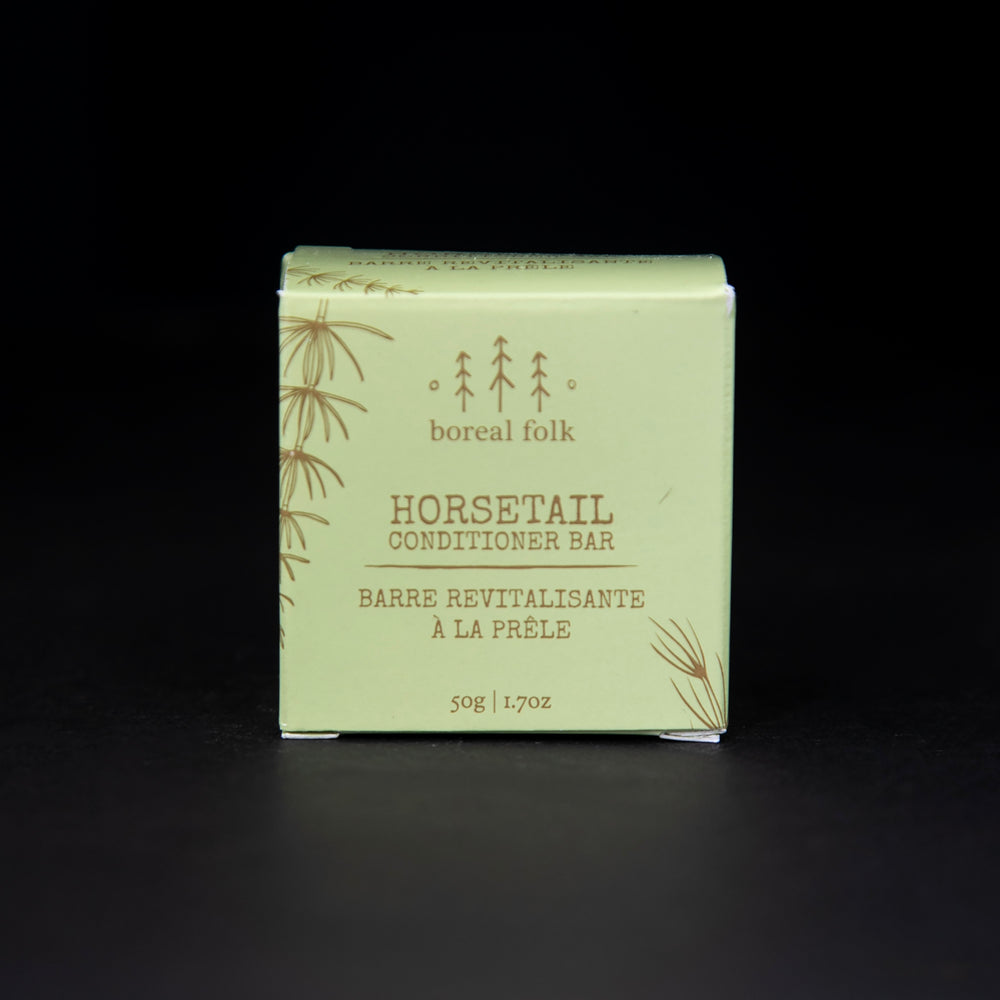 green cardboard box of Boreal Folk's horsetail conditioner against a black background