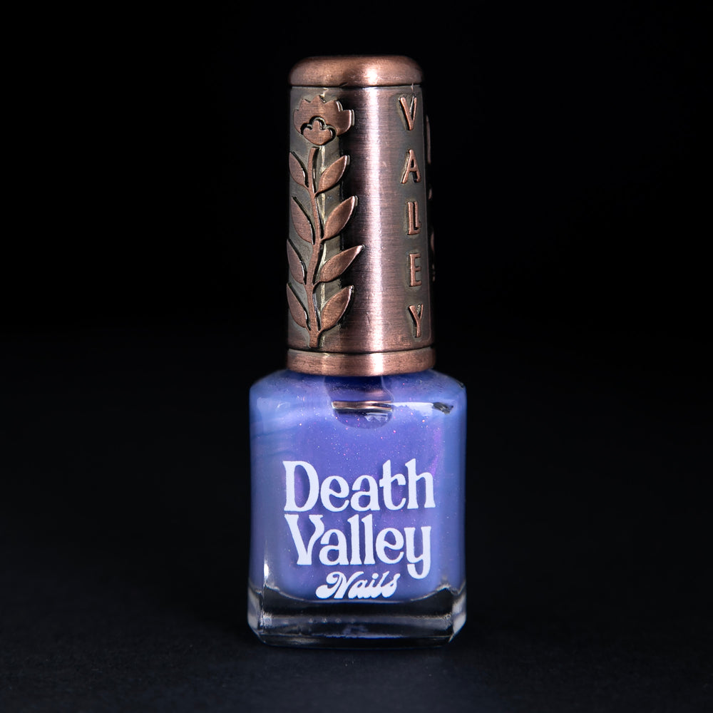 
                      
                        bottle of Death Valley Nails "I'd Let Him Eat Crackers" polish against black background
                      
                    