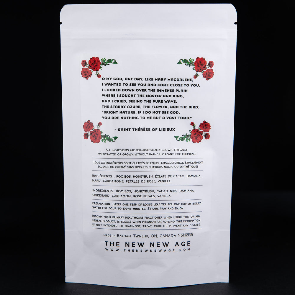 Backside of a white 50g pouch of "The Ecstasy of Mary Magdalene" herbal tea against black background. There are illustrations of roses pictures.
