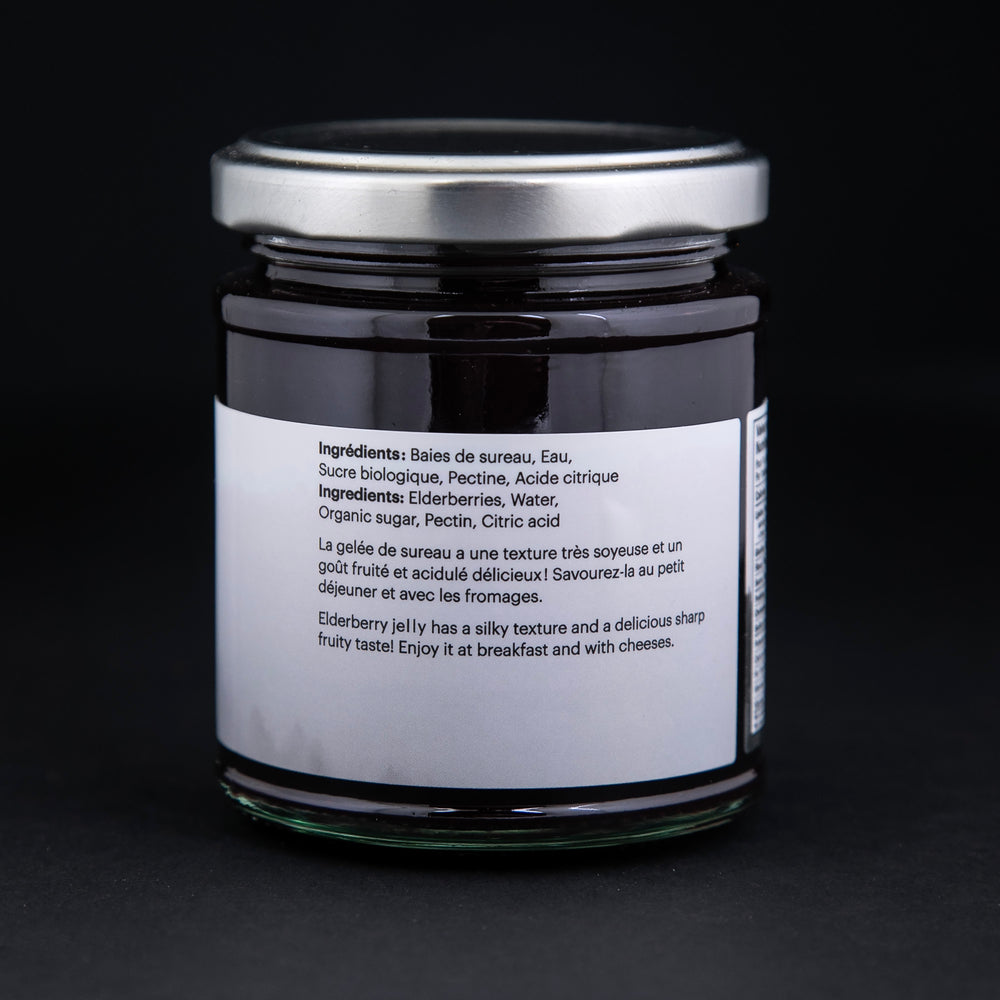 back label of a jar of elderberry jelly against a black background