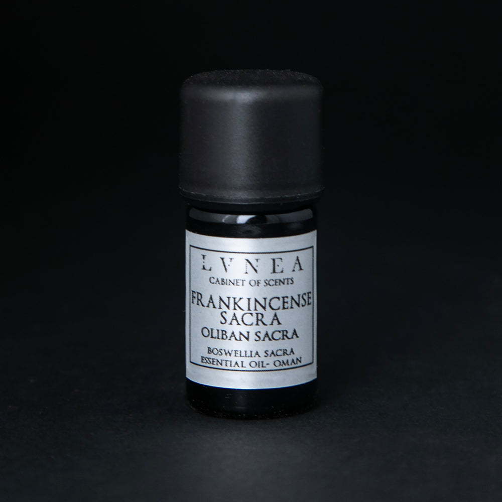 
                      
                        5ml black glass bottle with silver label of LVNEA's frankincense sacra essential oil on black background
                      
                    