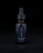1oz amber glass bottle with dropper top and black label, containing Rown + Sage's "Head Soother" tincture on black background.