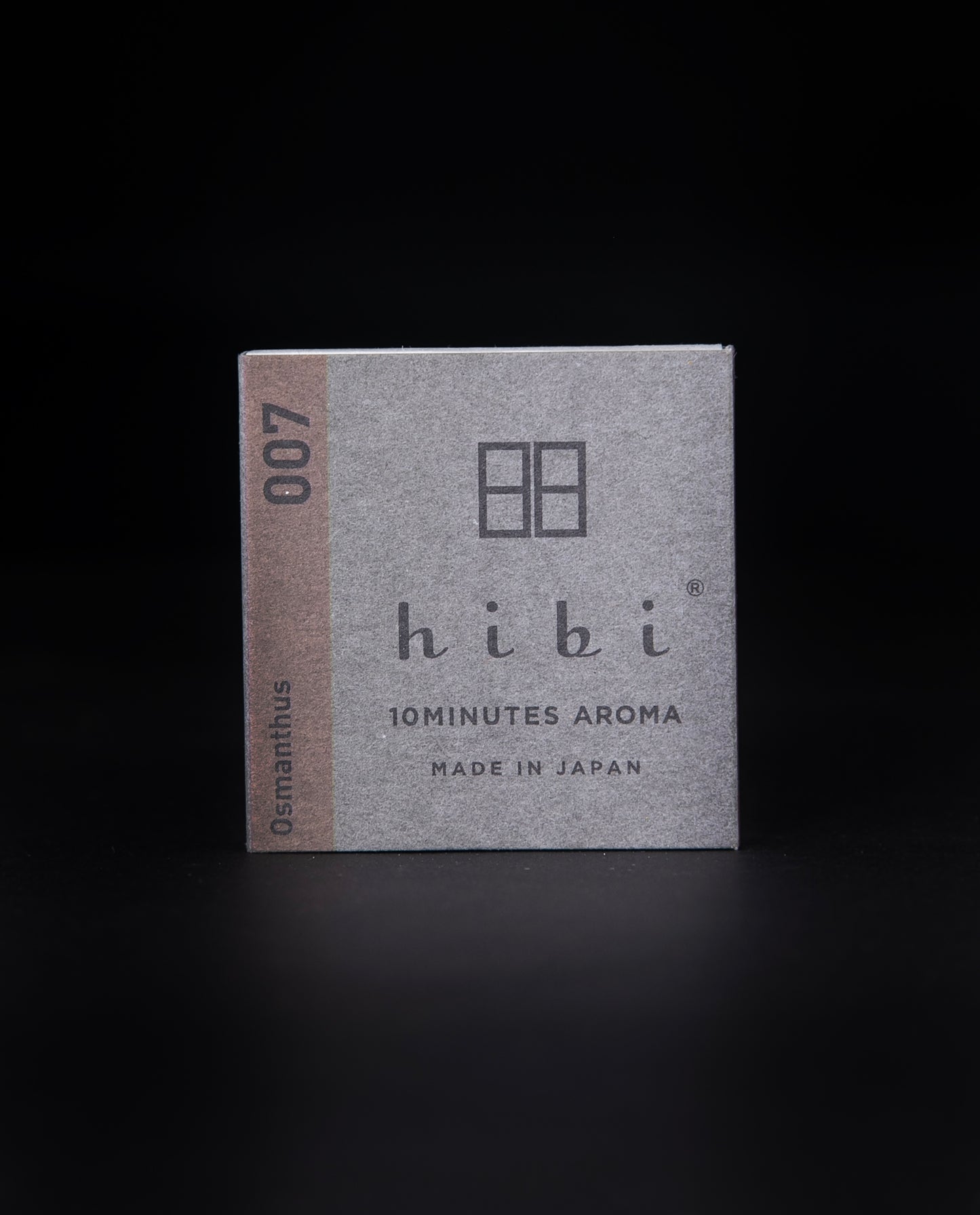 grey paper box of Hibi "Osmanthus" incense matches on a black background