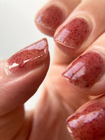 Close up of nails painted with Death Valley Nails' "Hibiscus and Beet Root" nail polish