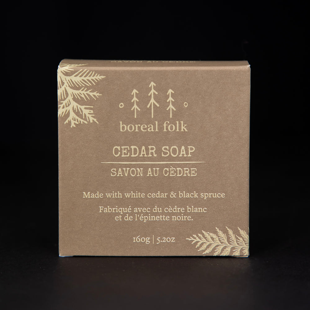 Light brown cardboard box of Boreal Folk's cedar soap against a black background