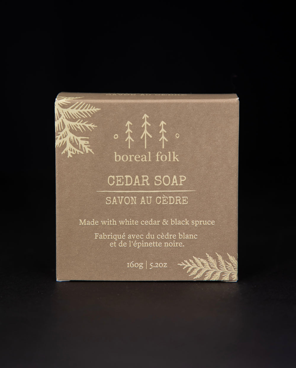 Light brown cardboard box of Boreal Folk's cedar soap against a black background