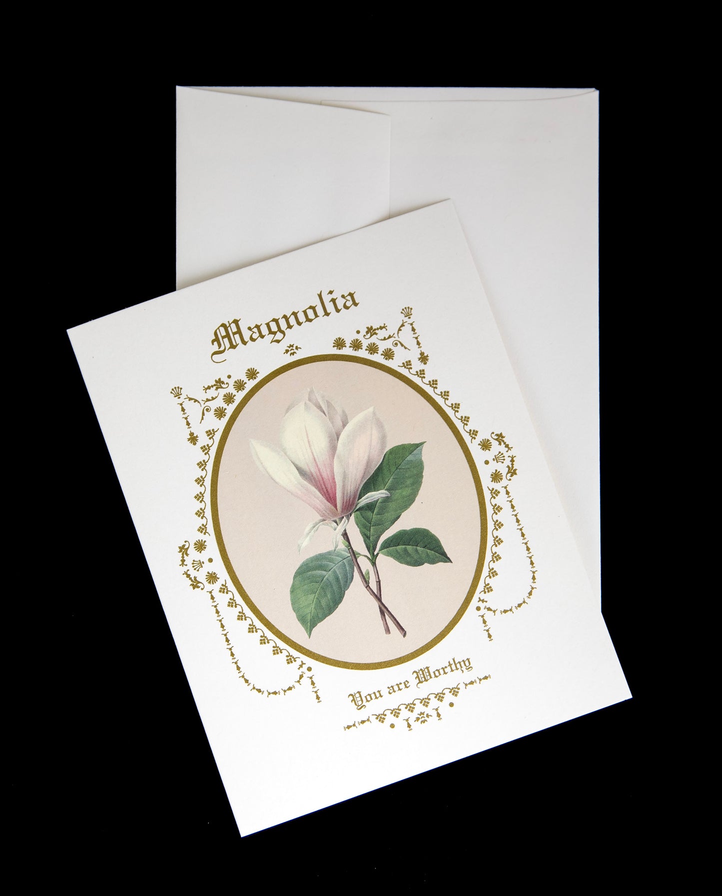 magnolia greeting card sitting on its envelope against a black background