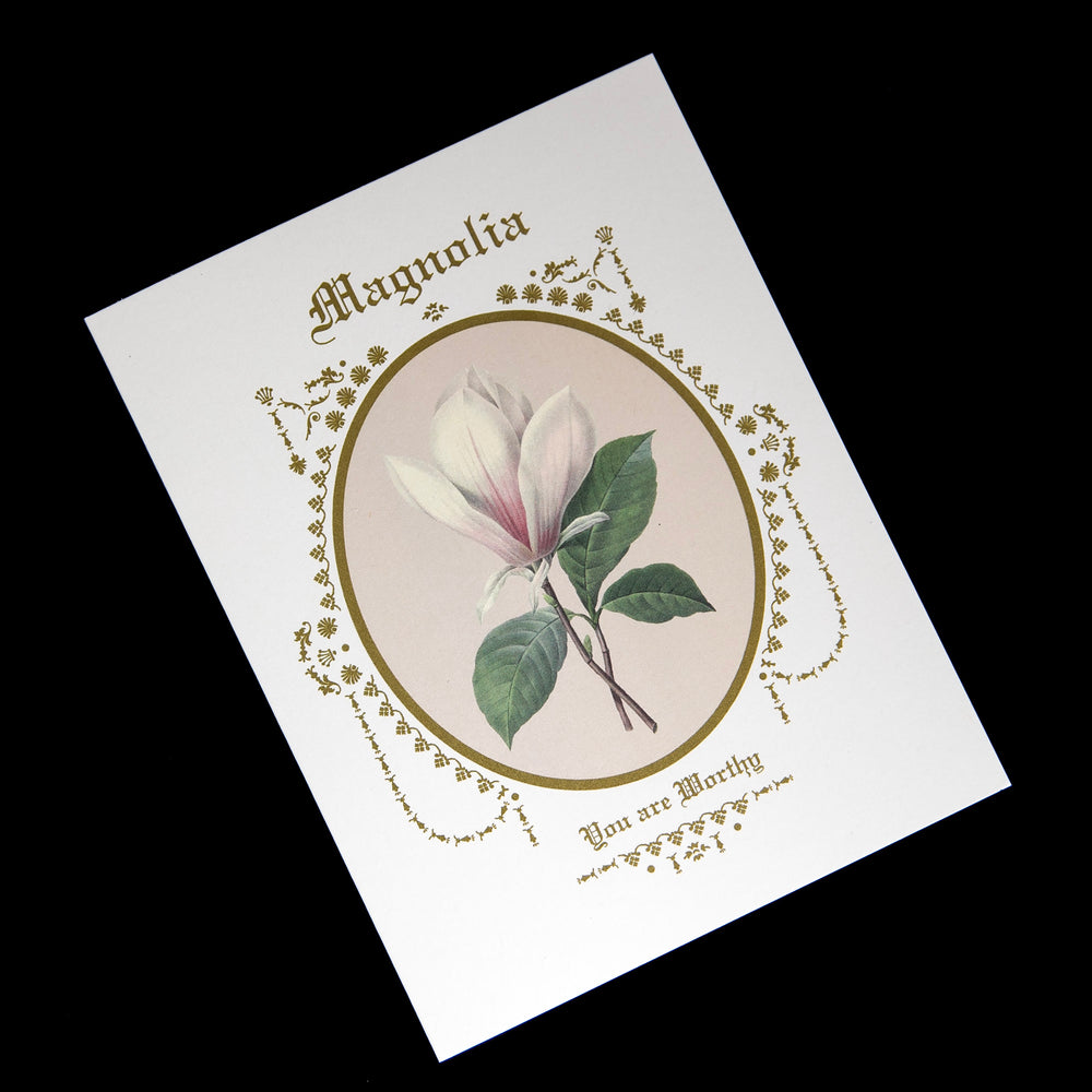 white card featuring an illustration of a magnolia in a gilded frame