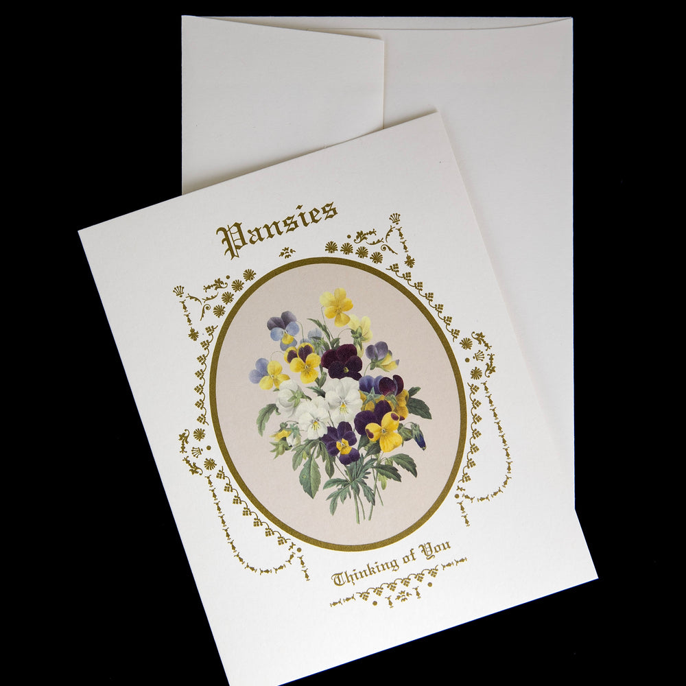 pansies greeting card sitting against its envelope on a black background