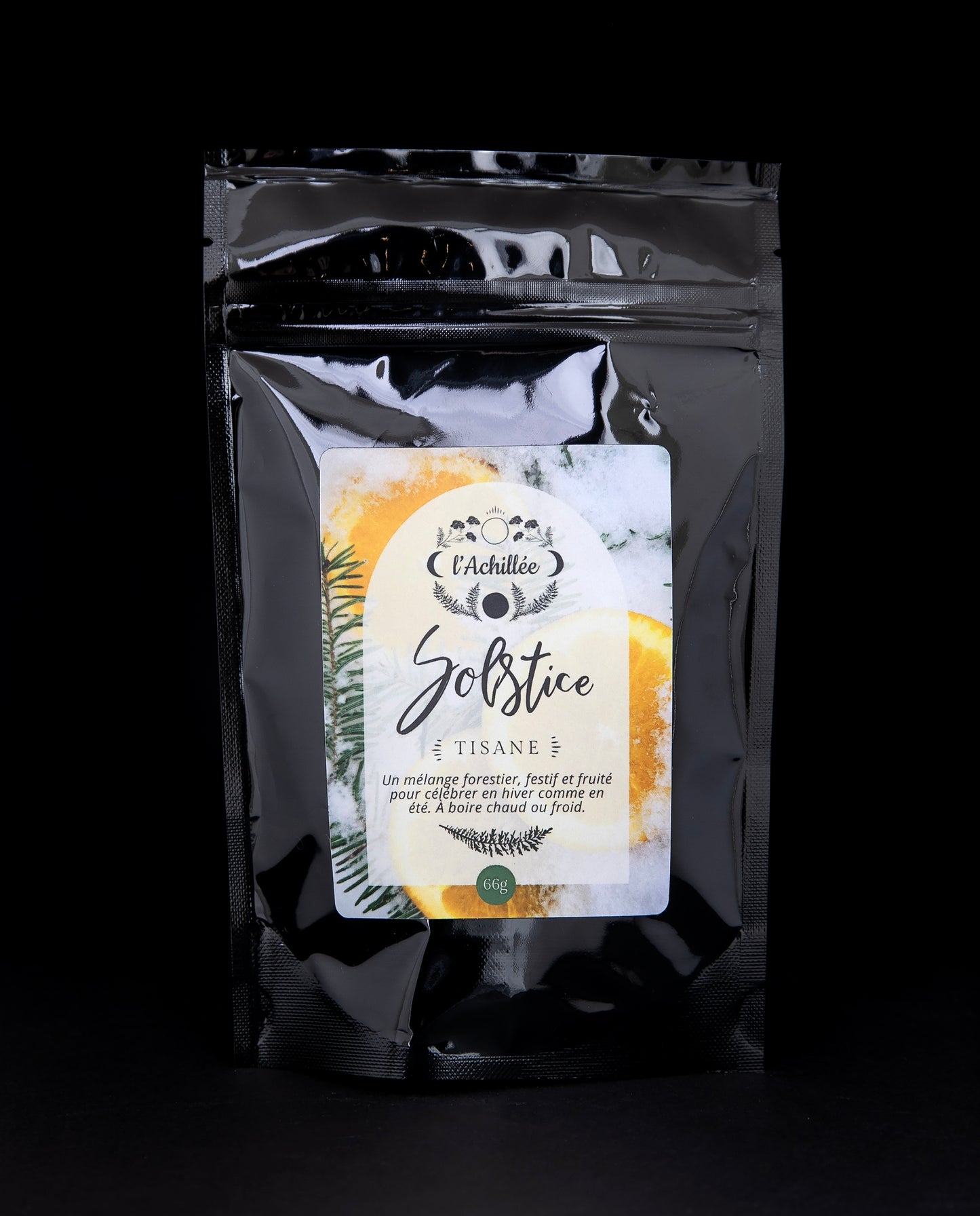 66g black bag of l'Achillée's "Solstice" herbal tea against a black background