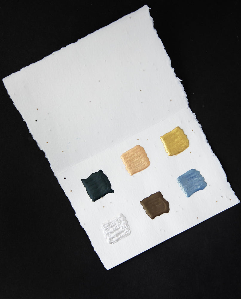 A natural paper card with 6 sample-sized watercolour swatches