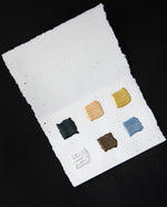 A natural paper card with 6 sample-sized watercolour swatches