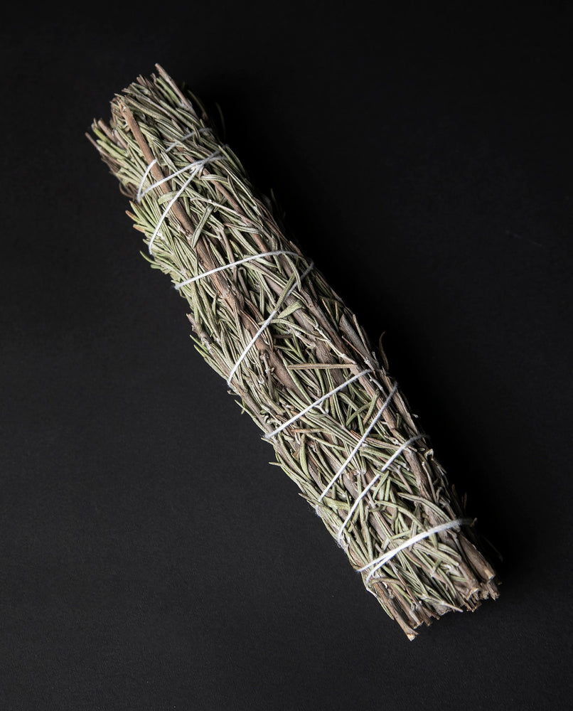 large bundle of dried rosemary wrapped in white string