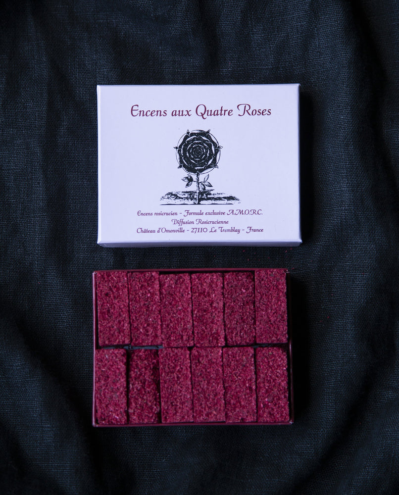 Open box revealing 12 tighly packed bricks of "Quatre Roses"  incense