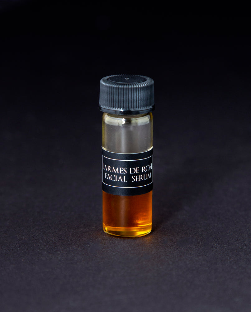 2ml clear glass sample vial of LVNEA's Larmes de Rose Facial Serum on black background