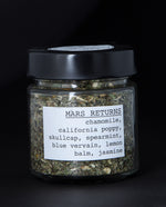 clear glass jar filled with a herbal tea blend by blueberryjams