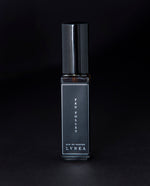 8ml clear glass bottle of LVNEA’s Feu Follet natural perfume on black background