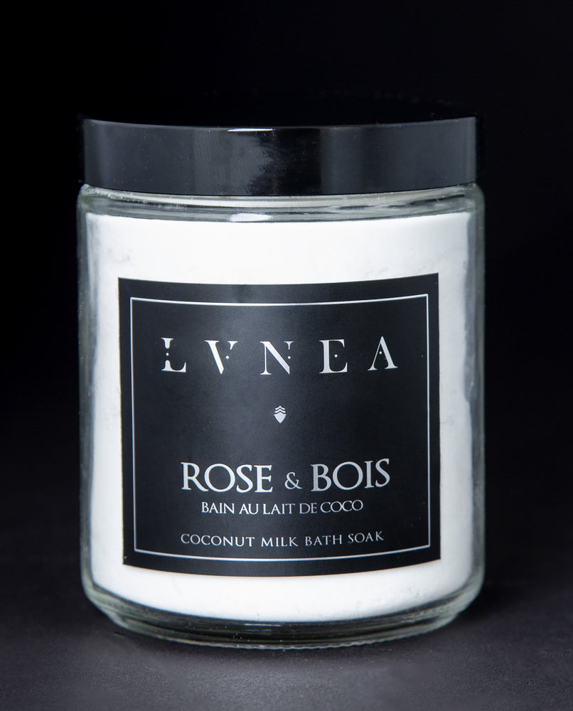 A clear 8oz jar filled with Rose & Bois, LVNEA's vegan coconut-based bath soak.