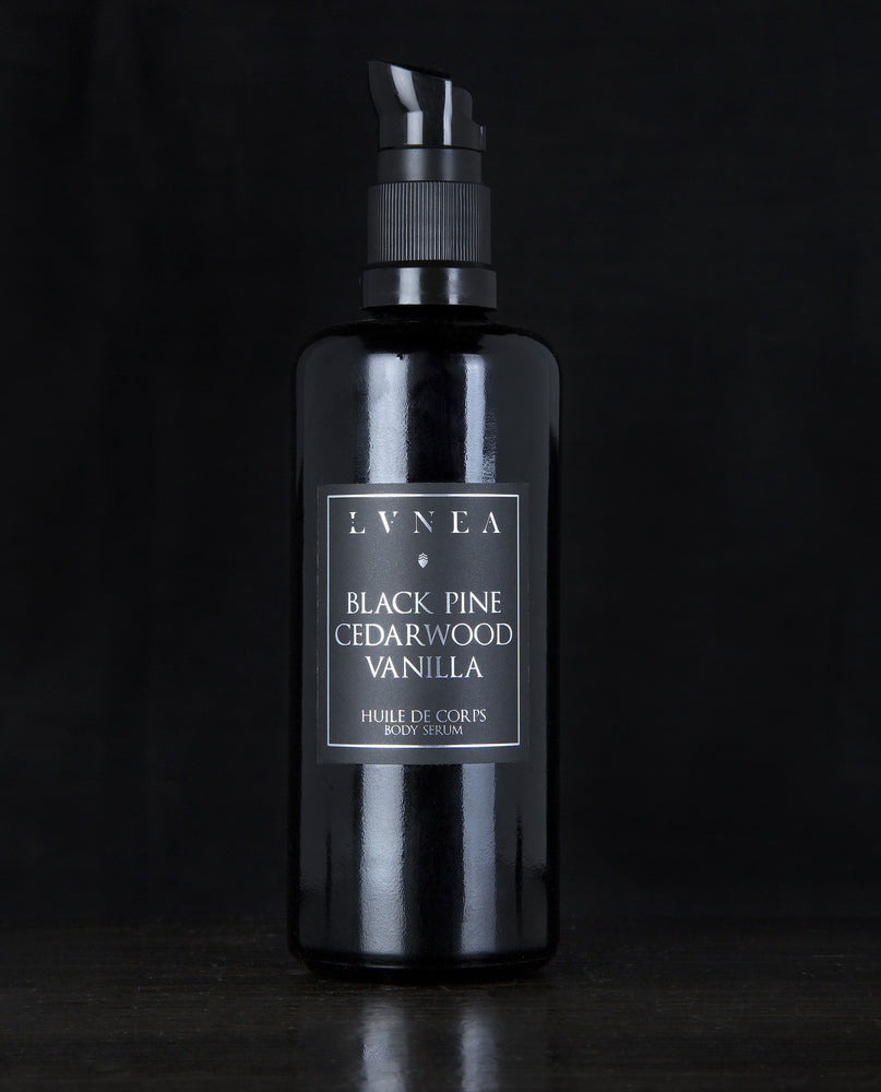 100ml black glass bottle with pump dispenser of LVNEA’s Black Pine, Cedarwood and Vanilla body serum