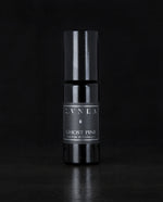 10ml black glass bottle of LVNEA's best-selling Ghost Pine roll on perfume oil on black background