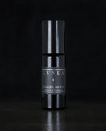 10ml black glass bottle of LVNEA's Dagger Moon natural roll on perfume on black background