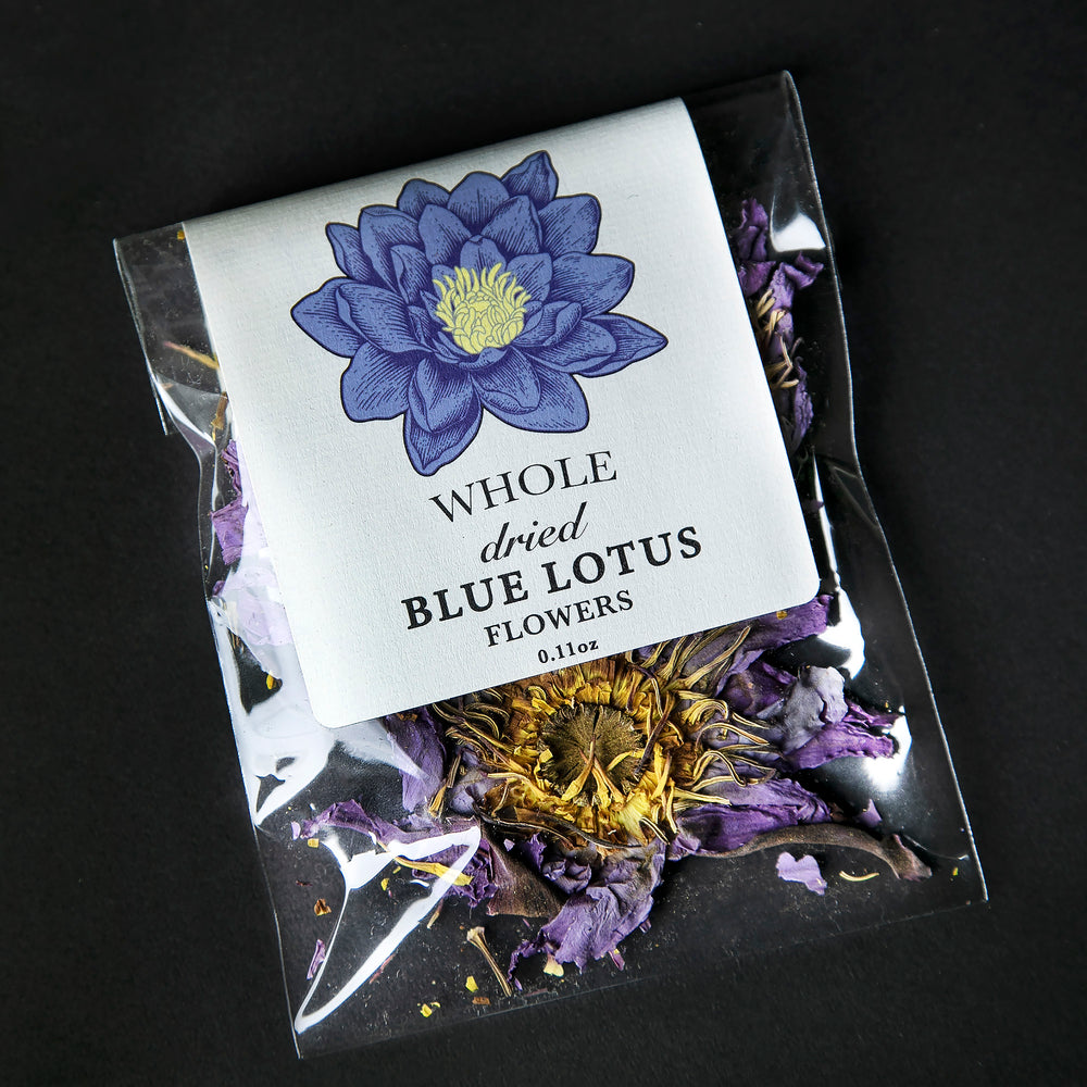 Whole blue lotus flowers in a clear plastic pouch.
