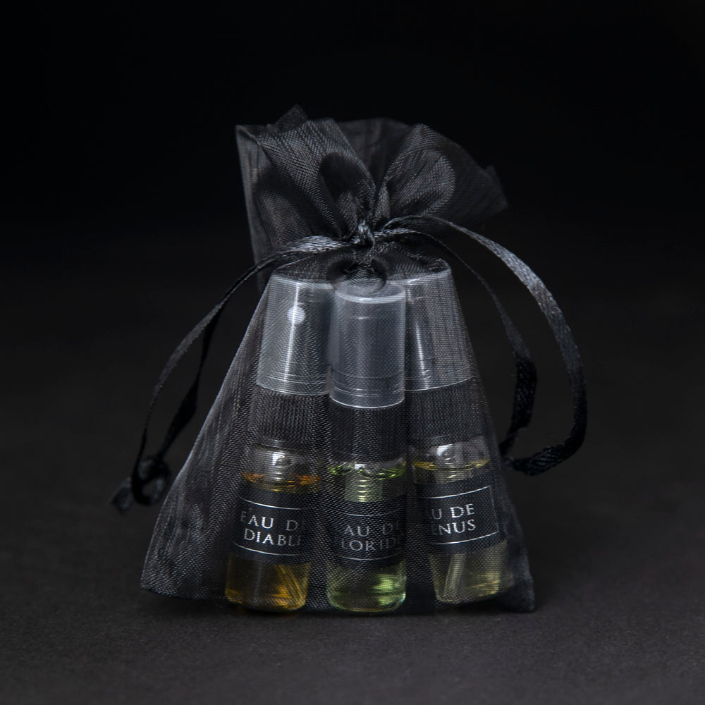 
                      
                        LVNEA Eau de Cologne sample set in black organza bag on black background.
                      
                    