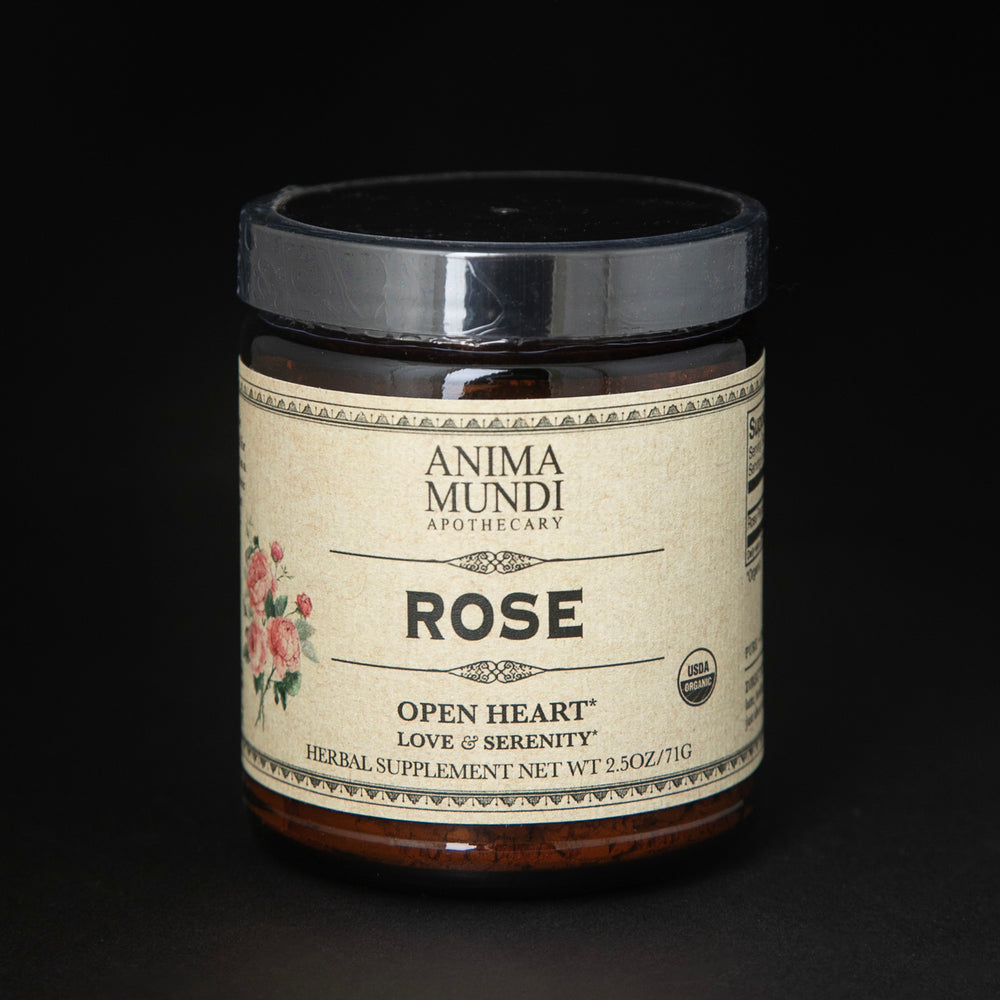 amber glass jar of Anima Mundi's "Rose" herbal supplement. The tan label reads "open heart, love and serenity".
