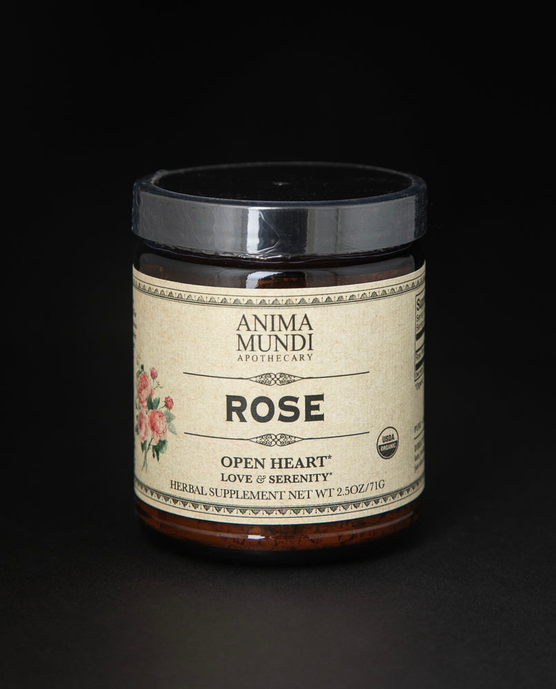 amber glass jar of Anima Mundi's "Rose" herbal supplement. The tan label reads "open heart, love and serenity".