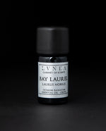 5ml black glass bottle of LVNEA's bay laurel essential oil on black background