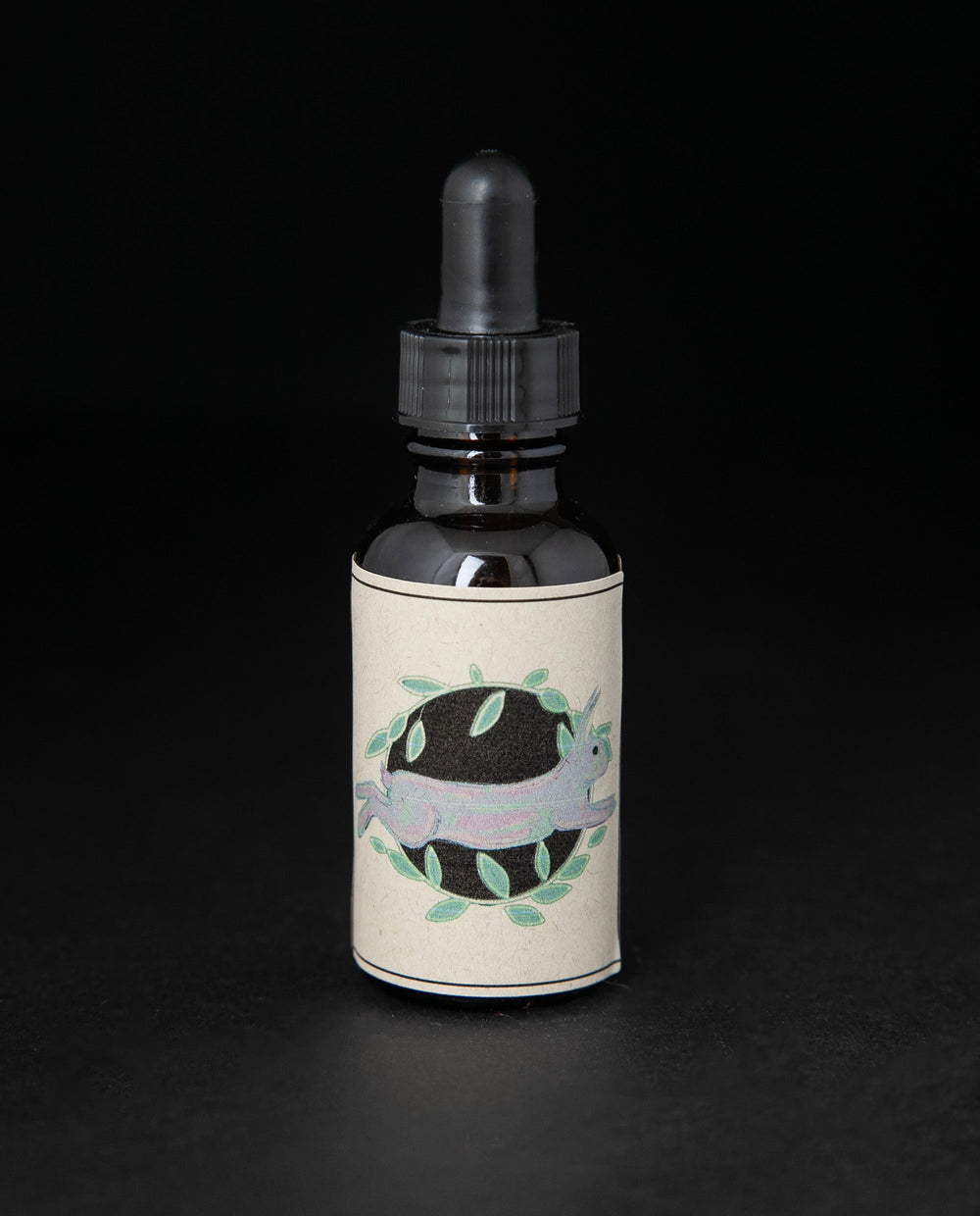 Black glass bottle with dropper top of blueberryjams' 