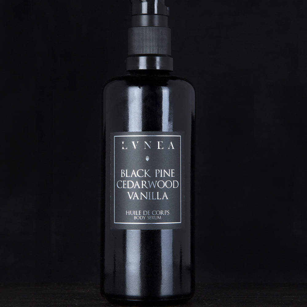 100ml black glass bottle with pump dispenser of LVNEA’s Black Pine, Cedarwood and Vanilla body serum