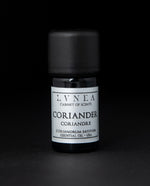5ml black glass bottle with silver label of LVNEA's coriander essential oil on black background