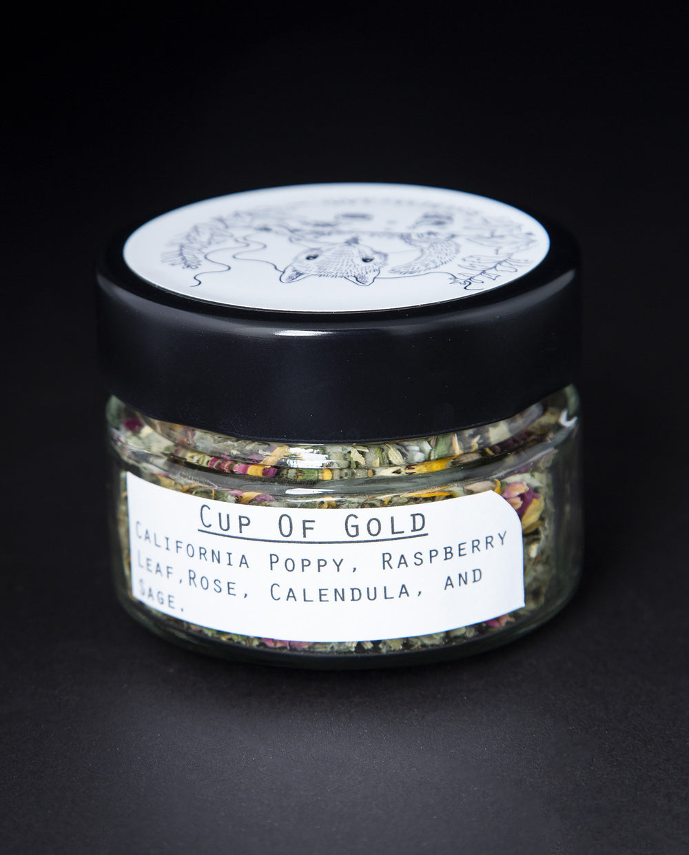 Clear glass jar with black lid containing blueberryjams' 