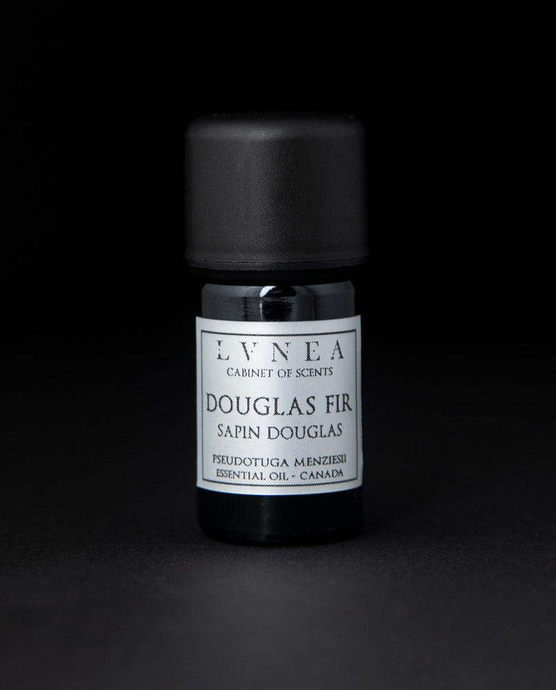 5ml black glass bottle with silver label of LVNEA's douglas fir essential oil on black background
